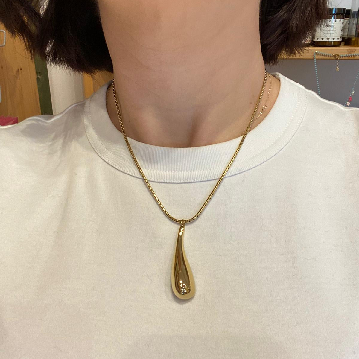 Collana con pendente in acciaio inossidabile color oro